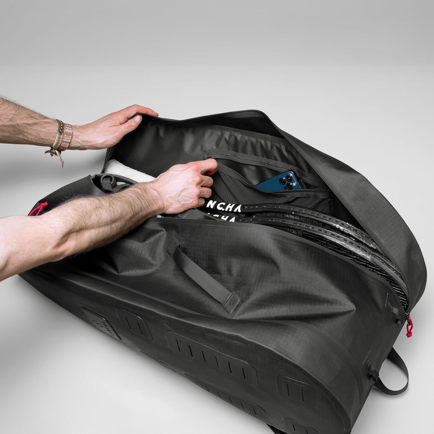 Cancha Racquet Bag Pro, Weatherproof 6-Racquet Tennis Bag for Travel, Black | Ventilated shoe pocket, padded straps and multi-compartment storage for shoes, clothes and gear. Recycled ripstop nylon.