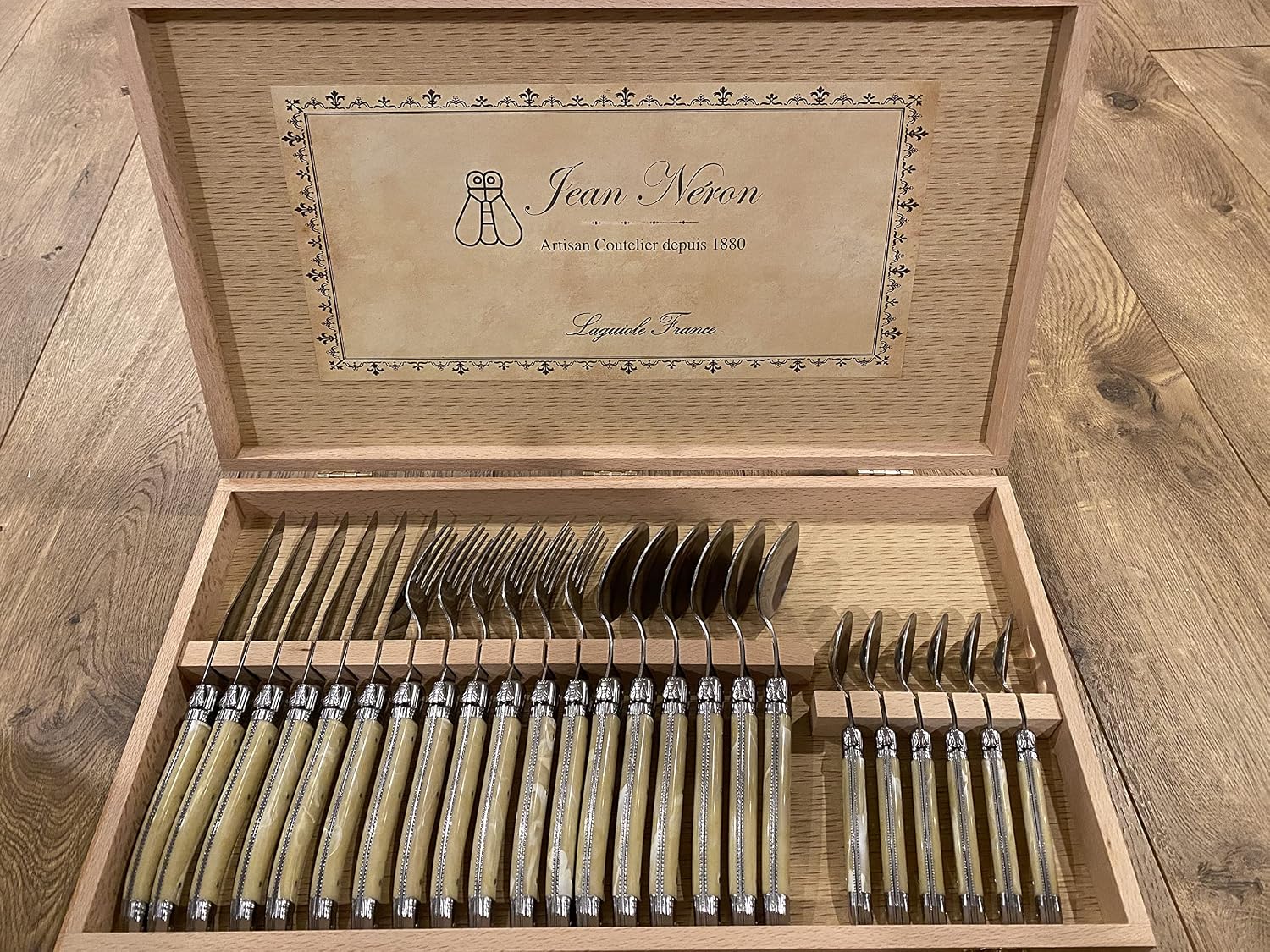 Set of 24 Flatware with Platine Pale Horn Handles, 6 Forks, 6 Knives, 6 Teaspoons and 6 Tablespoons. In Wooden Gift Box